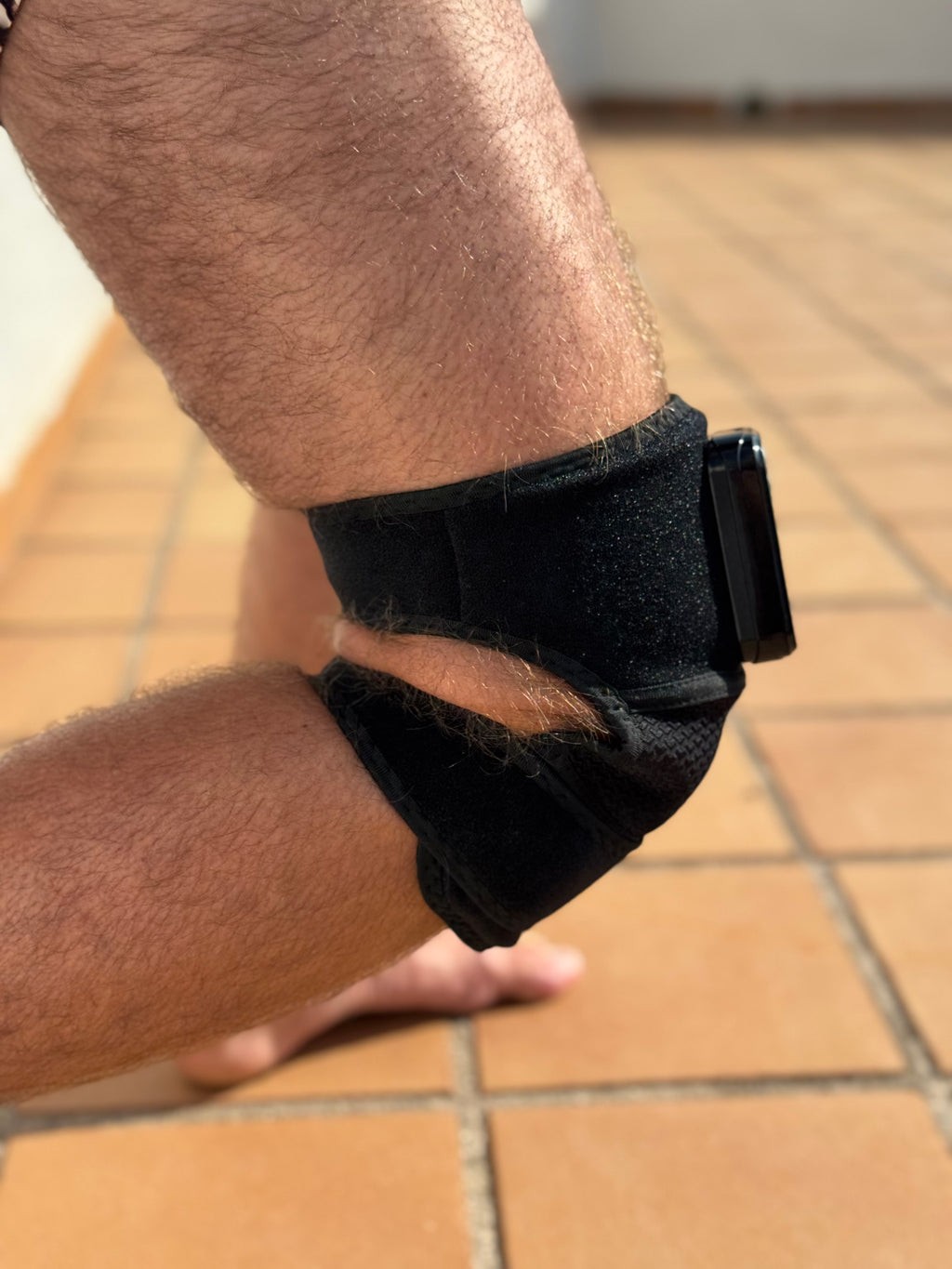 RecoverWave wrap used on elbow with extension straps, real product photo